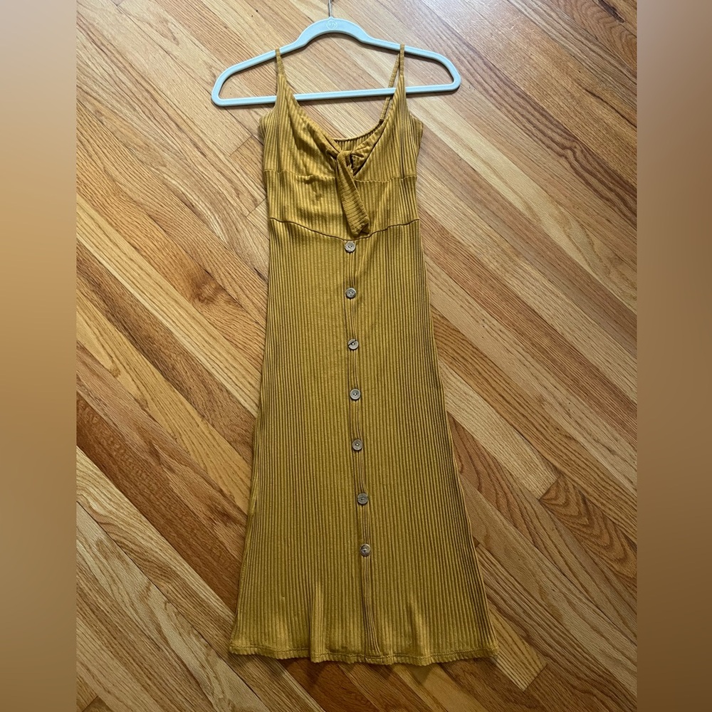 Yellow hand crafted long yellow dress from boutique in Barcelona, Spain
